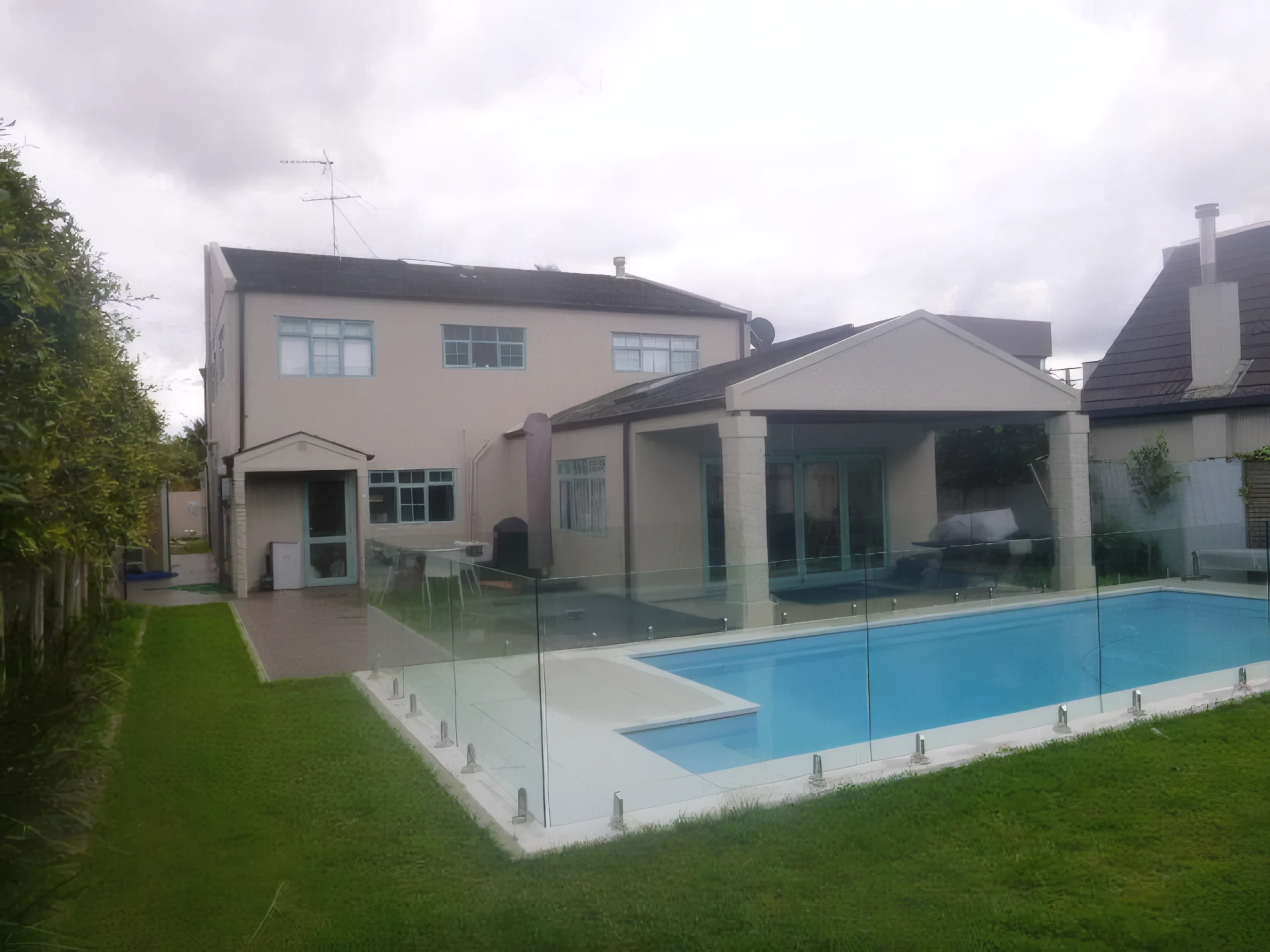 Milford Road before renovation — original stucco house and pool